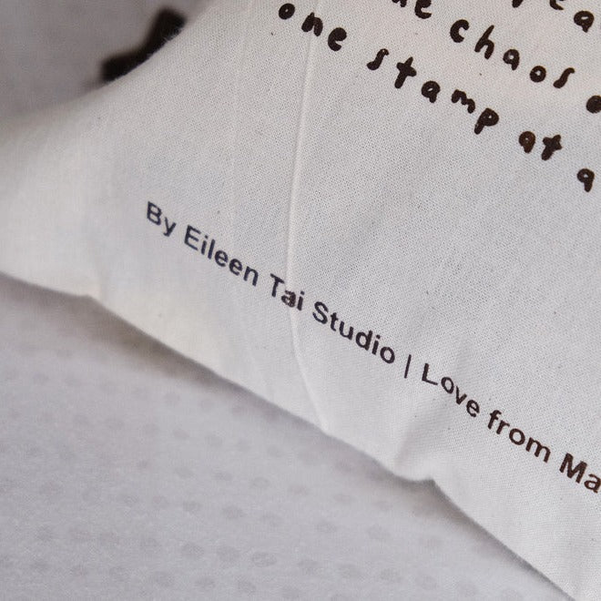 Brown One Stamp at a Time drawstring pouch fabric detail with Eileen Tai Studio printed text