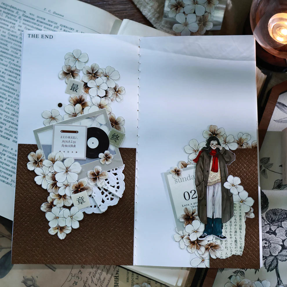 Book decorated with Dusk Vintage Flower PET Tape floral and figure illustrations on wood
