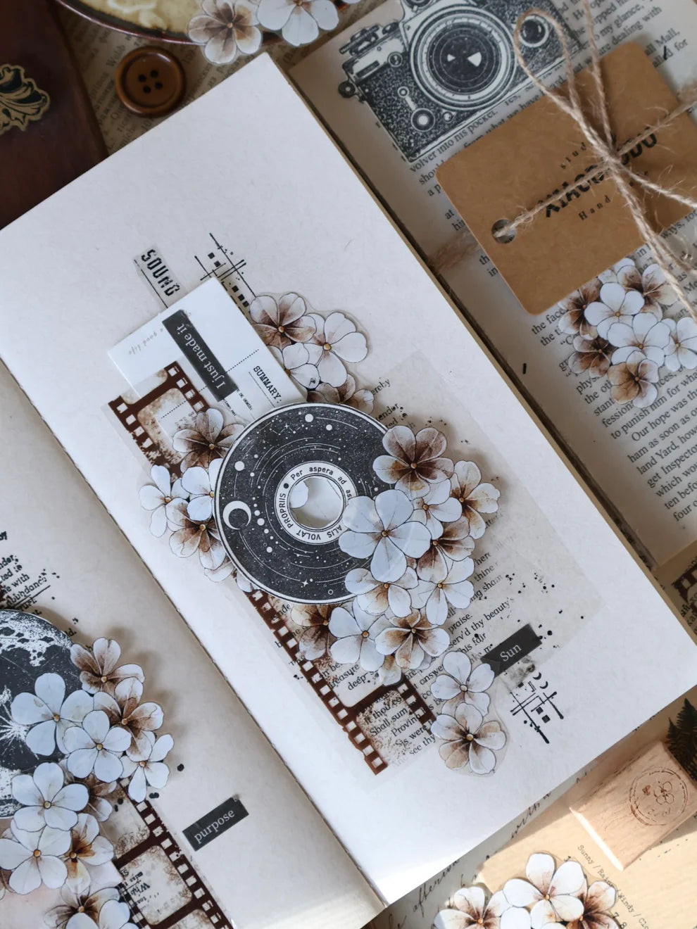 Card decorated with Dusk Vintage Flower PET Tape florals and a film reel design on texture