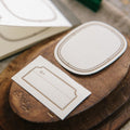 Wooden stamp block with carved design on a textured surface
