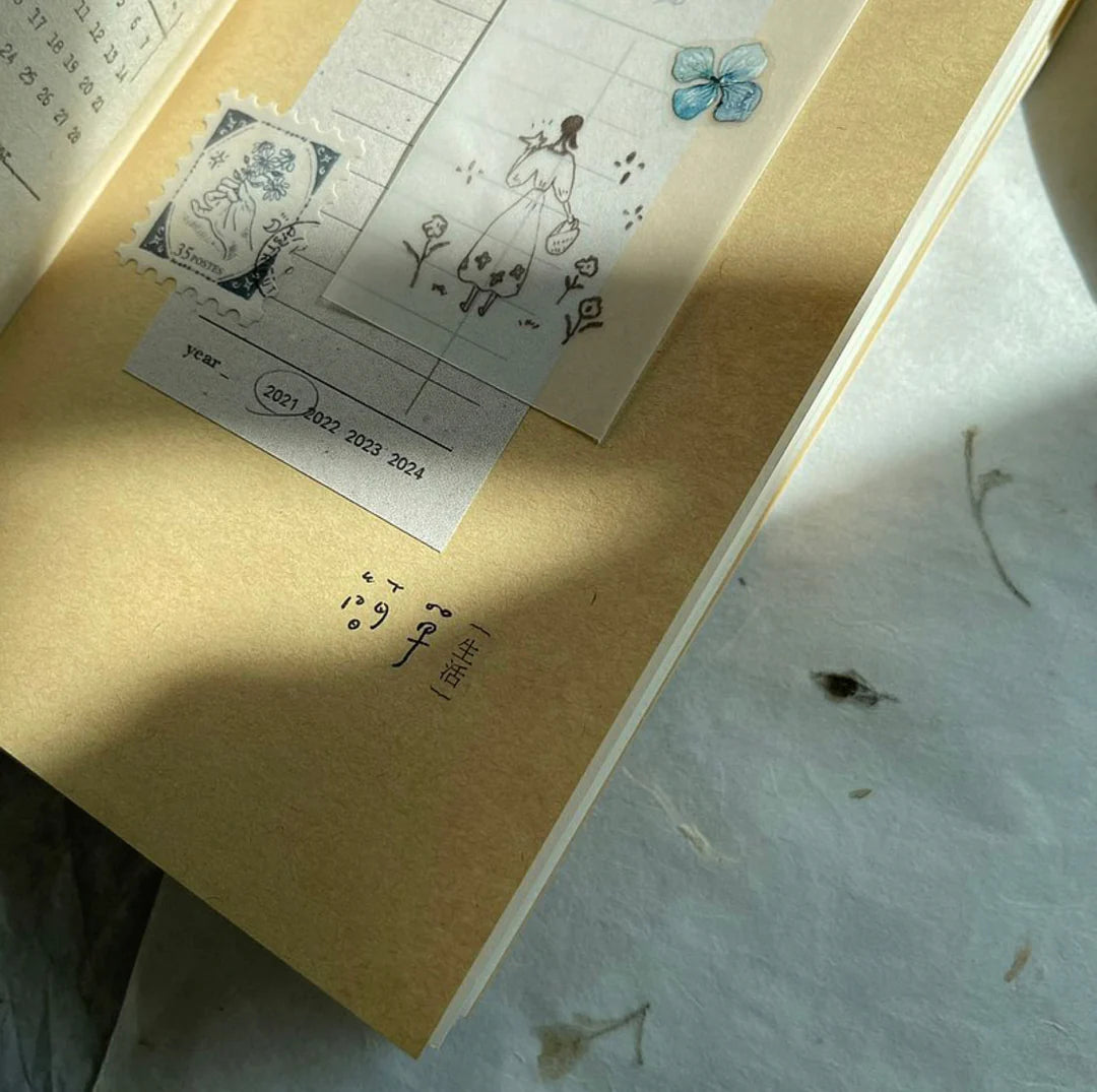 Vintage book styled with Embossing Transfer Sticker floral elements on a textured surface