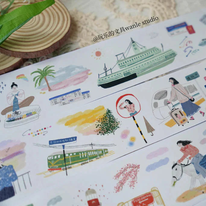 Sheet of En Route Washi Tape travel-themed illustrations displayed on a textured surface