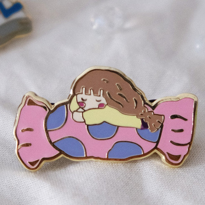 Sweet Like Candy Enamel Pin with a cartoon character on a pink candy-shaped design, close-up
