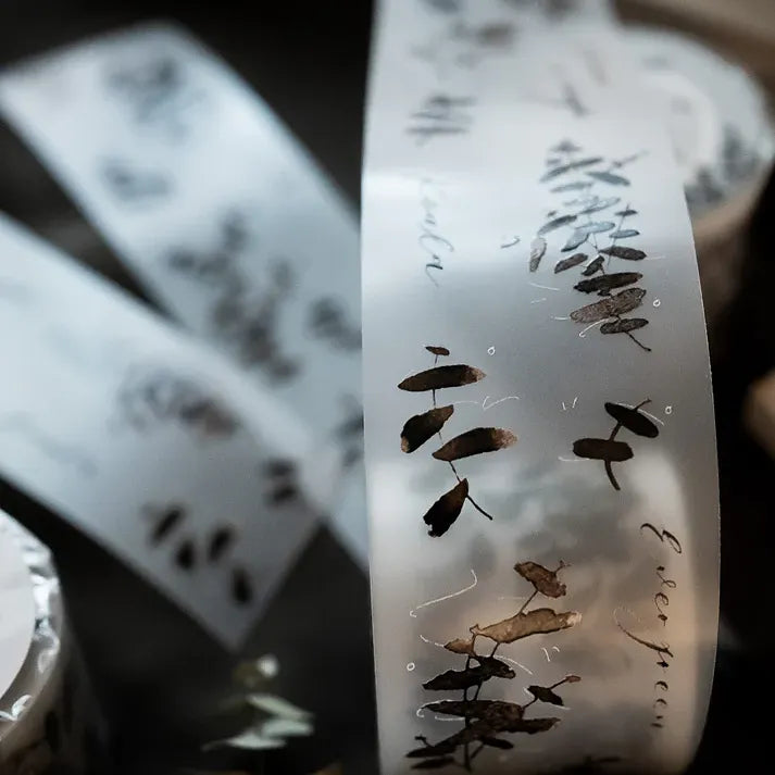 Roll of Eucalyptus Matte PET Tape showing delicate embossed leaf detailing, macro shot of the tape edge