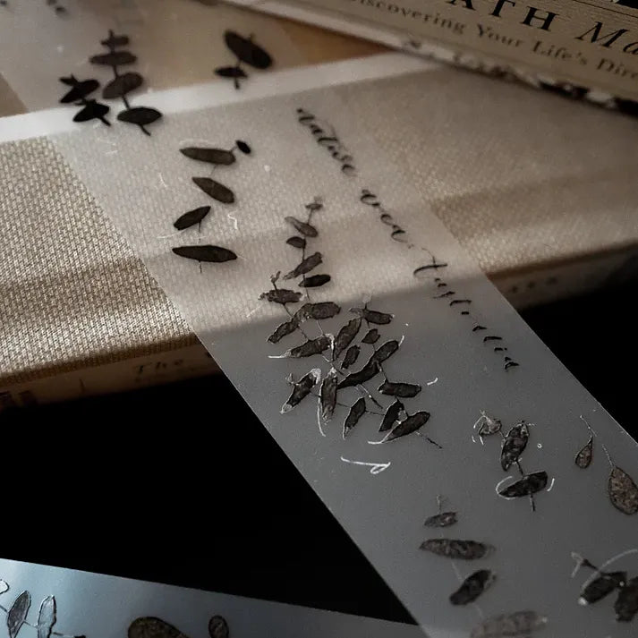 Eucalyptus Matte PET Tape styled with pressed flowers on a vintage book against a soft blurred background