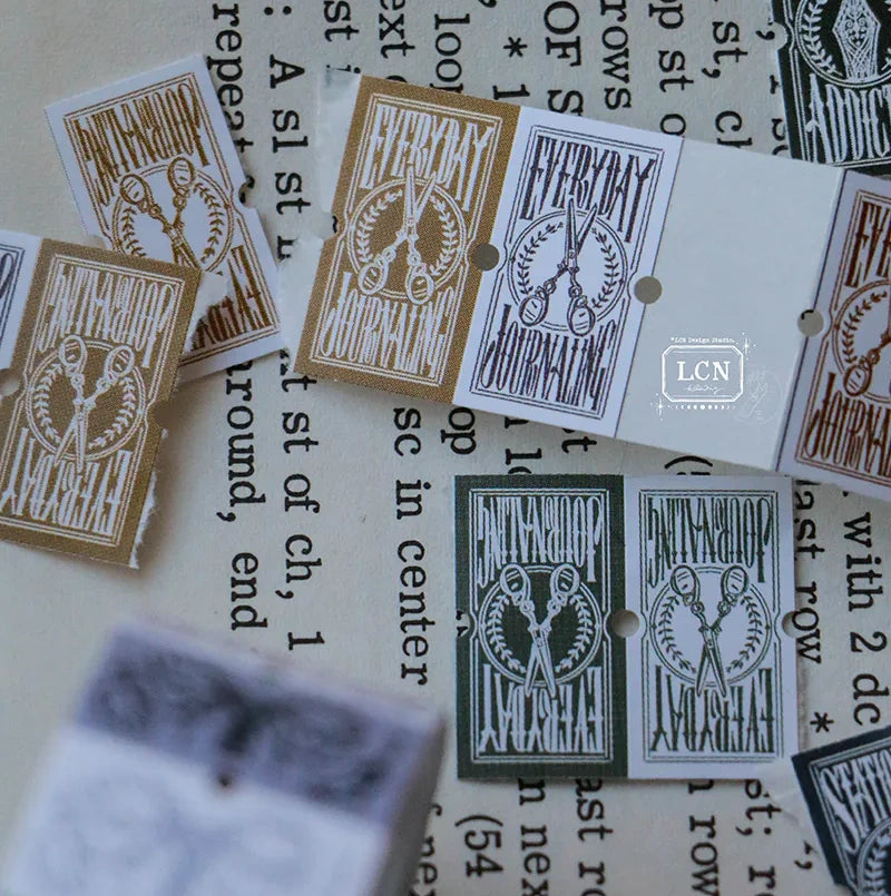 Everyday Journaling Label Tape strip of Everyday labels on a textured paper background