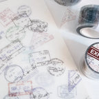 Collection of travel stamps on paper with additional stamps in the background.