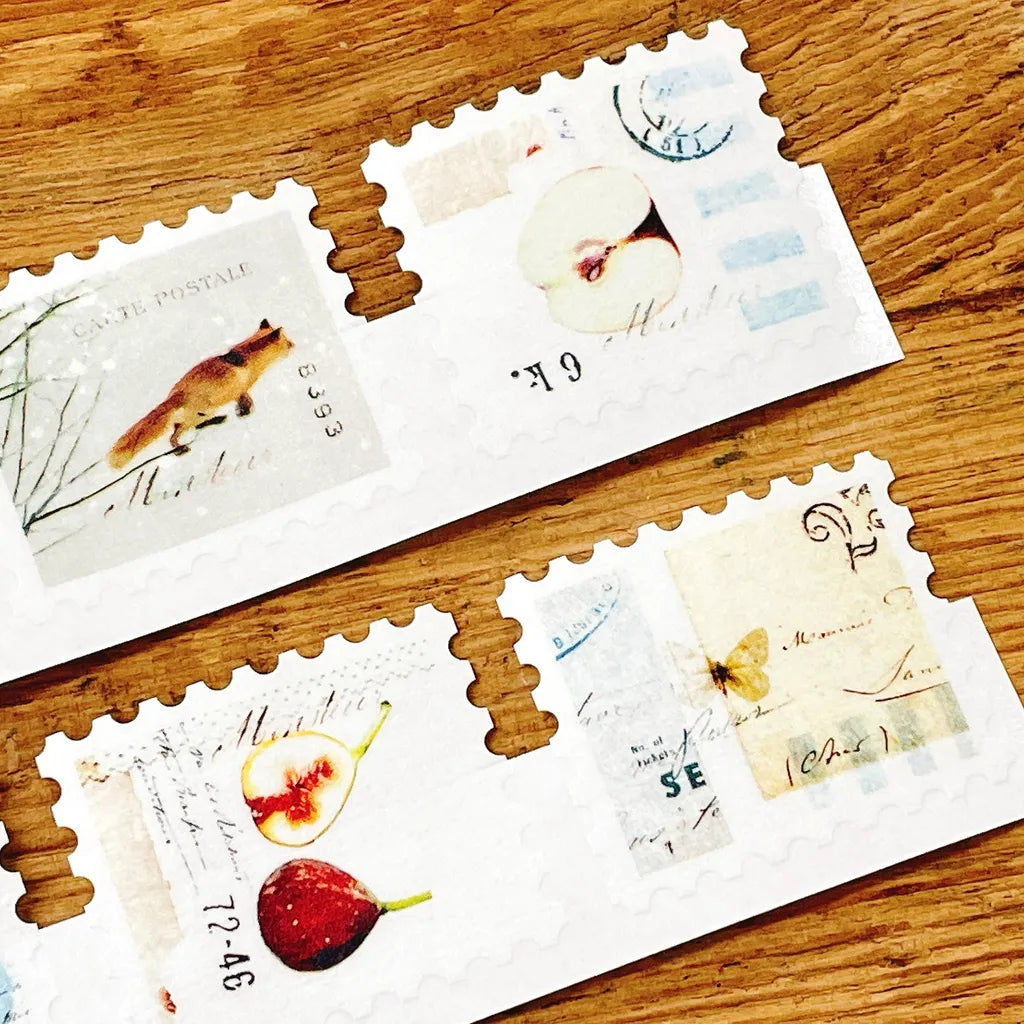FR-001 Washi Tape vintage stamp and illustration designs on envelopes on a wooden surface