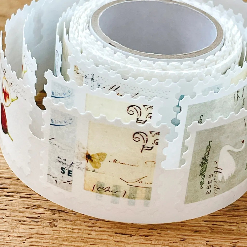 Roll of FR-001 Washi Tape with vintage-style precut designs resting on a wooden surface