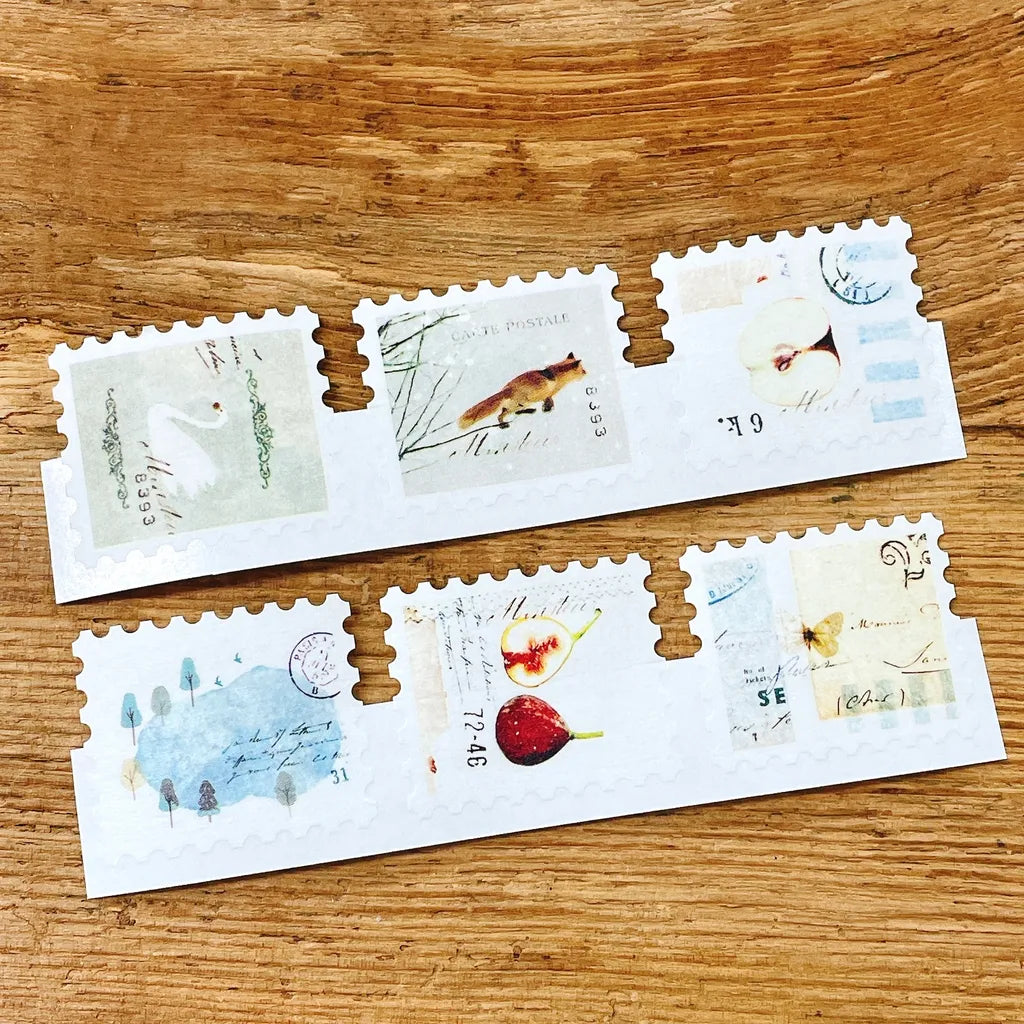 Second styled view of FR-001 Washi Tape artistic designs on envelopes on a wooden desk