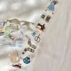 Set of sewing-themed stickers on a white background