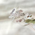 Clear plastic mold with rabbit and butterfly designs on a white background
