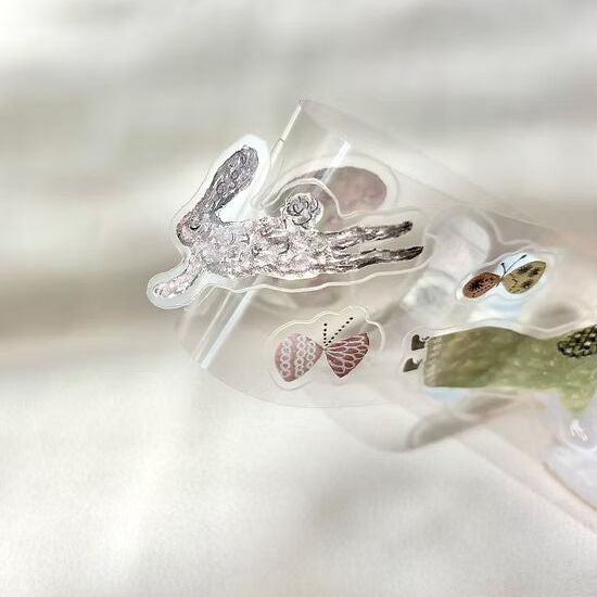 Clear Fabric PET Tape sheet with rabbit and butterfly designs on a white background