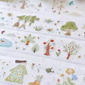 Children's fabric with nature-themed illustrations including trees, flowers, and animals.