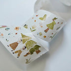 Roll of decorative tape with fairy design on a white background