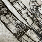 Close-up of fabric with printed design featuring text and numbers on a white background