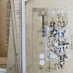 Collage of vintage paper with text and numbers on a textured surface