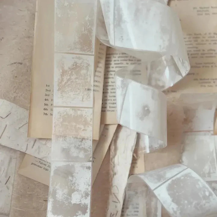 Film Noir 06 PET Tape sheer ruffled fabric design styled over an open book on texture