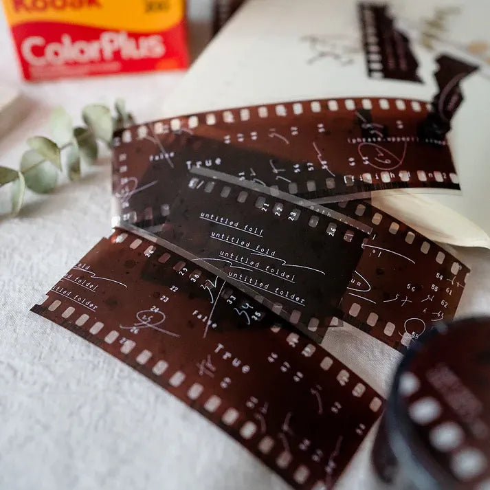 Film PET Tape negatives styled with a Kodak ColorPlus 35mm film box on a textured craft background