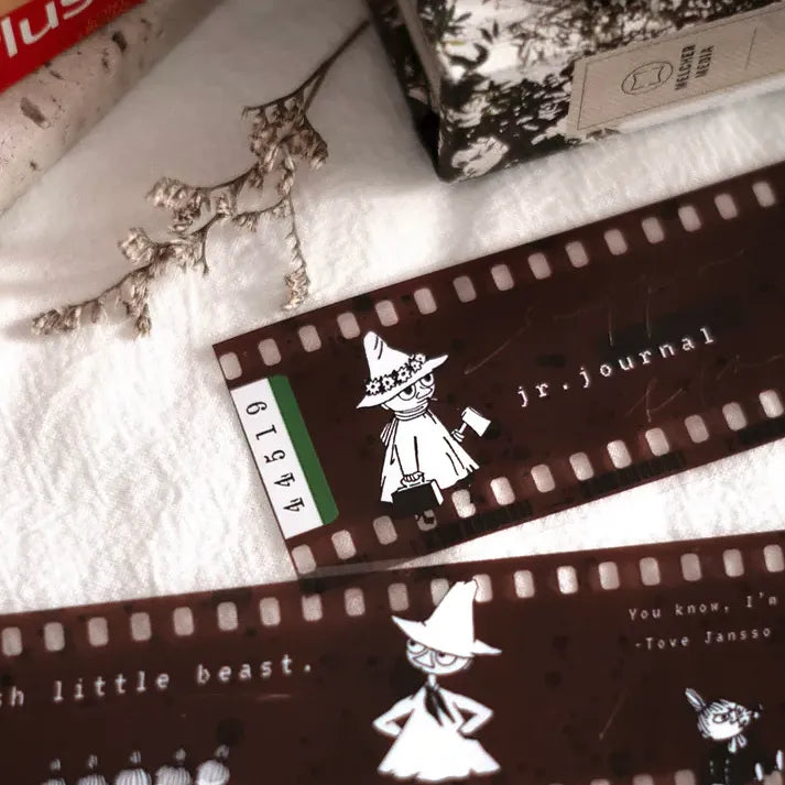 Close-up of Filmoomin ft. Moomin PET Tape showing Moomin character art and text on a textured surface