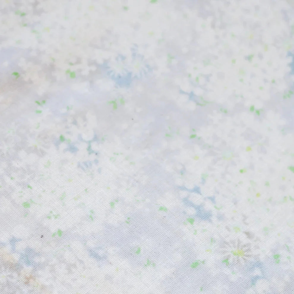 Textured fabric with a subtle pattern on a light background