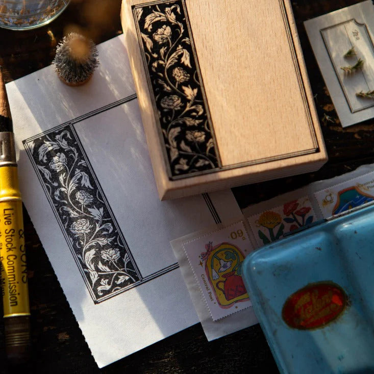 Flower Frame A Rubber Stamp displayed with stationery items on a craft surface, styled view