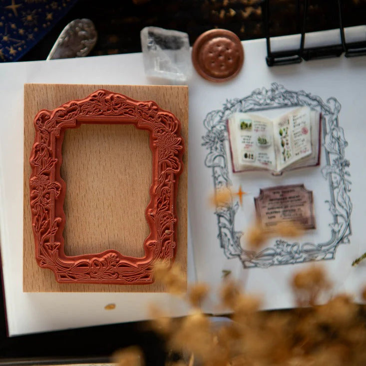 Decorative red frame on a white surface with a blurred background