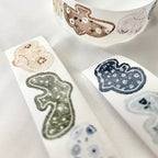 Set of animal-shaped stamps on a white surface