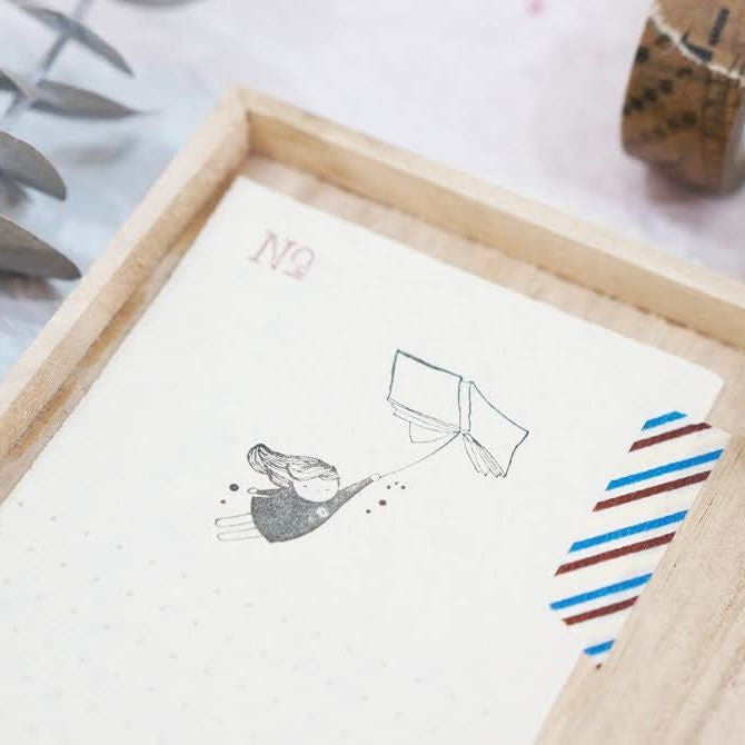 Alternate view of the Flying Book Rubber Stamp showing its imaginative winged book impression