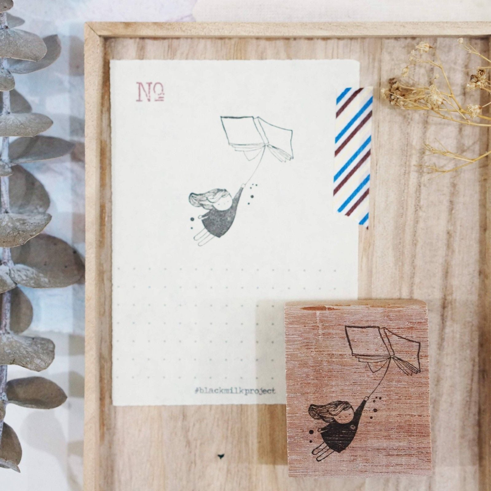 Third view of the Flying Book Rubber Stamp with its storybook-magic design, styled detail