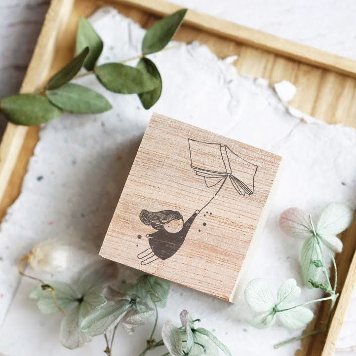 Flying Book Rubber Stamp by Black Milk Project with a whimsical soaring book design, main view