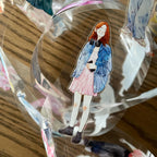 Illustration of a girl in a denim jacket and pink skirt on a transparent background