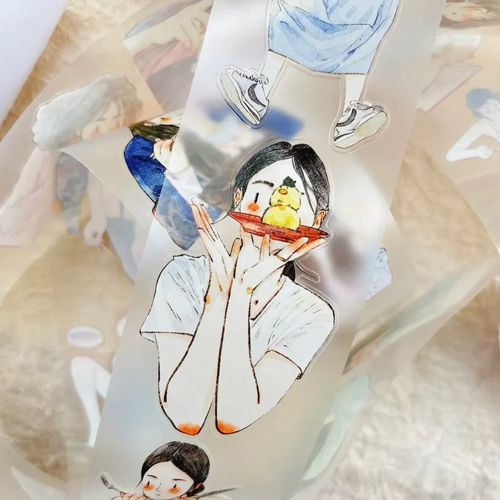 A close-up of a transparent vinyl sticker tape featuring watercolor-style illustrations of young women, shown lying on a soft beige surface.