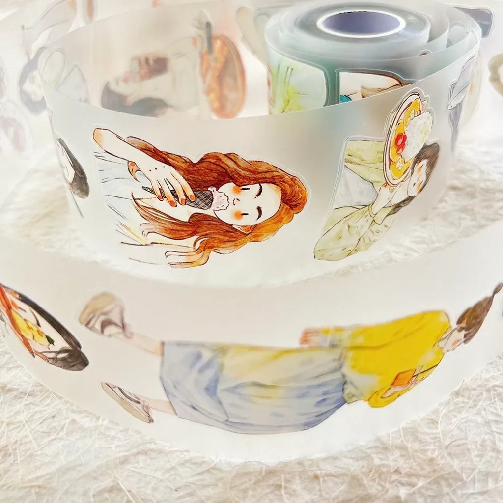A close-up of a roll of decorative adhesive tape featuring watercolor-style illustrations of girls in school uniforms, displayed on a textured white surface.