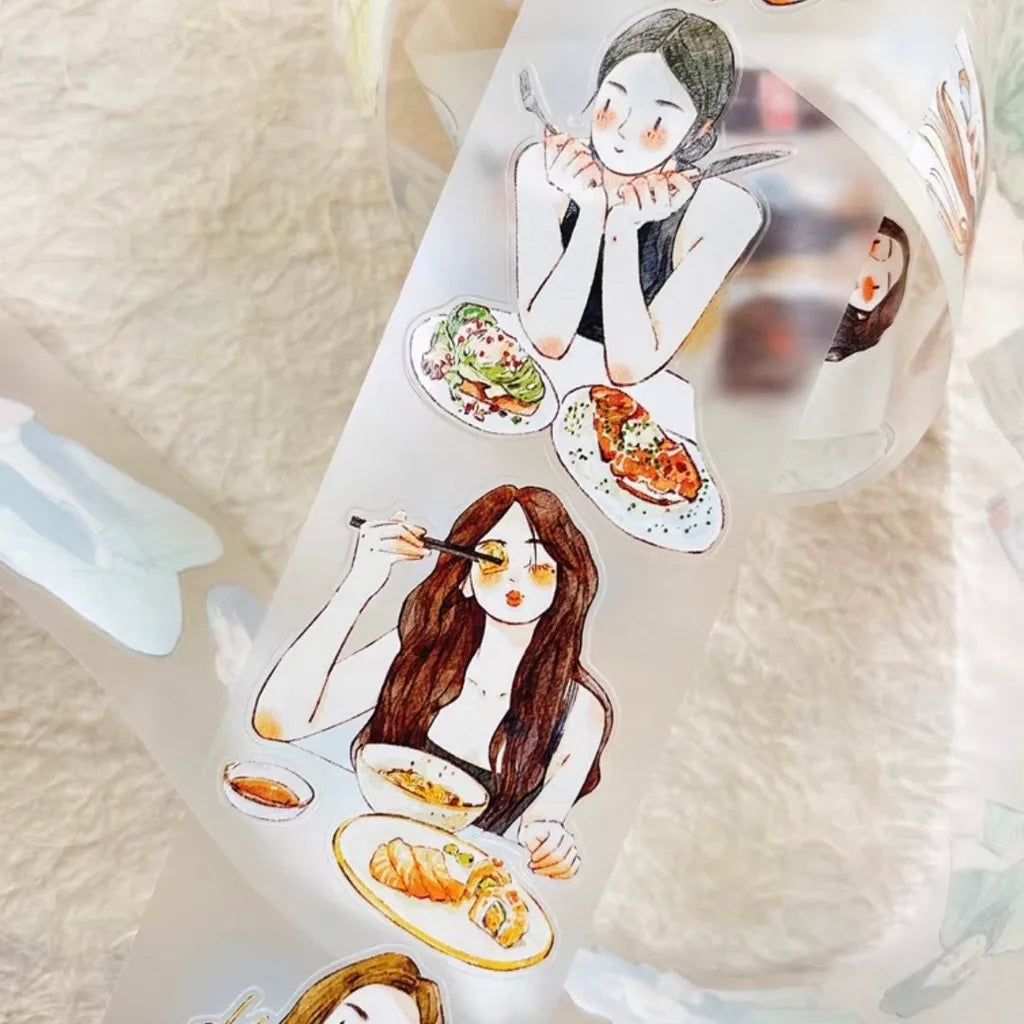 A roll of decorative adhesive tape featuring watercolor-style illustrations of young women dining at tables with plates of food, photographed on a soft cream fabric background.