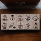 Set of wooden stamps with bear-themed designs on a wooden surface.