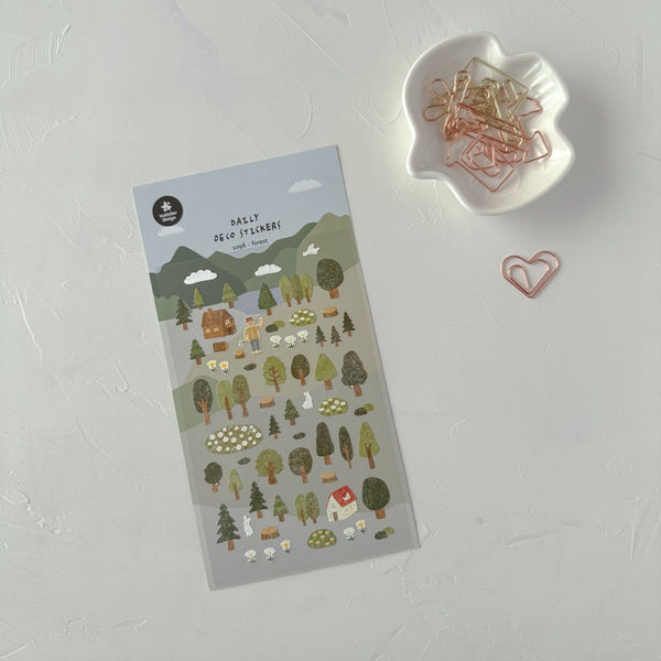 Forest Sticker Sheet by Suatelier, nature-themed stickers on a white surface with paper clips