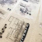 Clear stamp set with musical notes, text, and decorative elements on a textured surface.