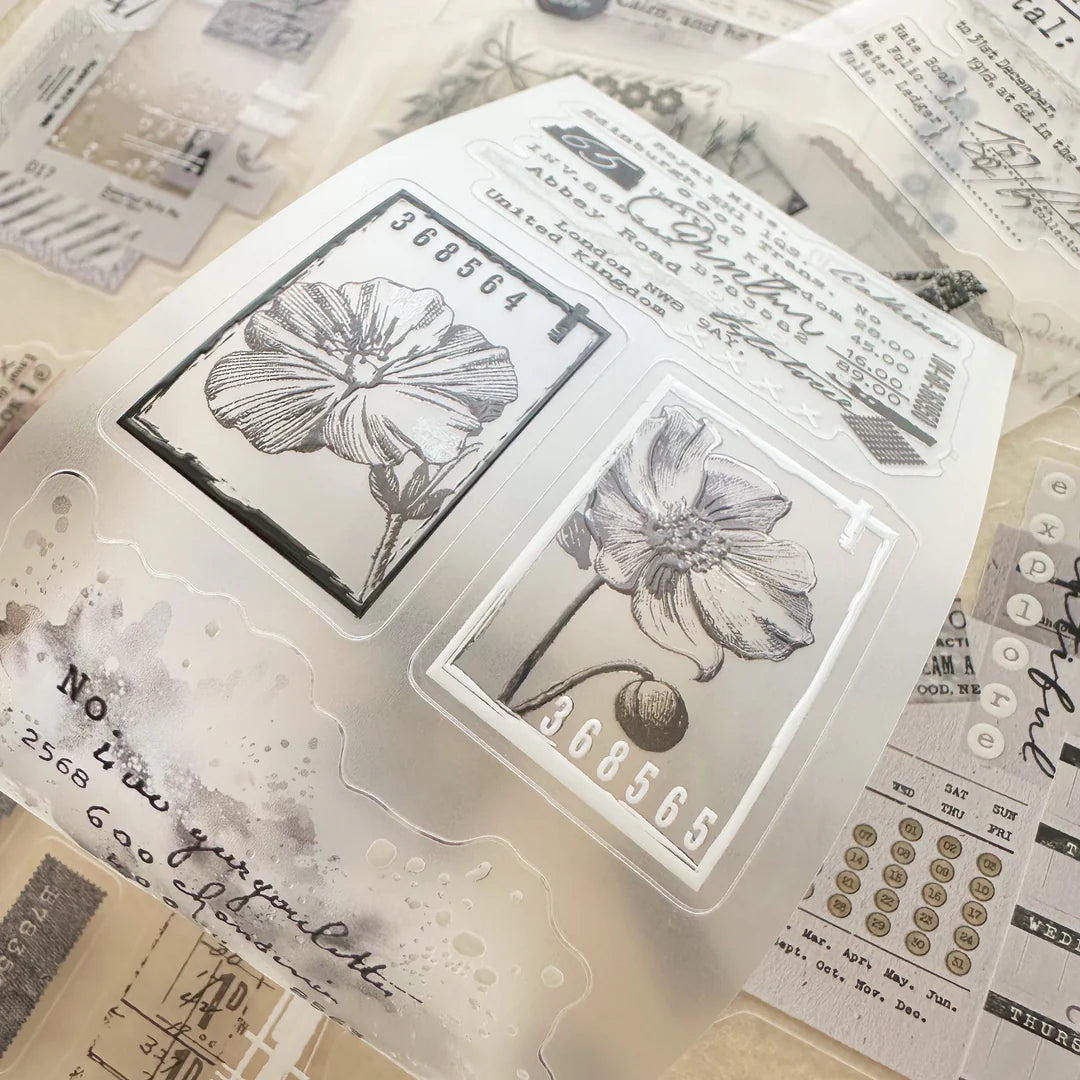 Fragment Crystal PET Tape clear floral designs displayed on a textured surface, top view