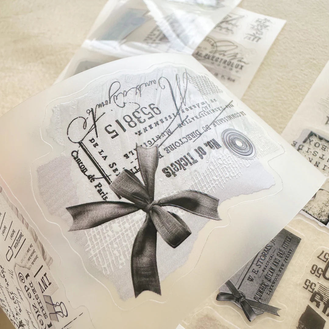 Fragment Crystal PET Tape vintage text design styled with a bow on a textured surface