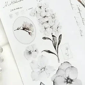 Set of black and white floral and leaf designs on a white background