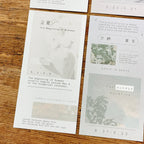 Cards with text and images on a wooden surface