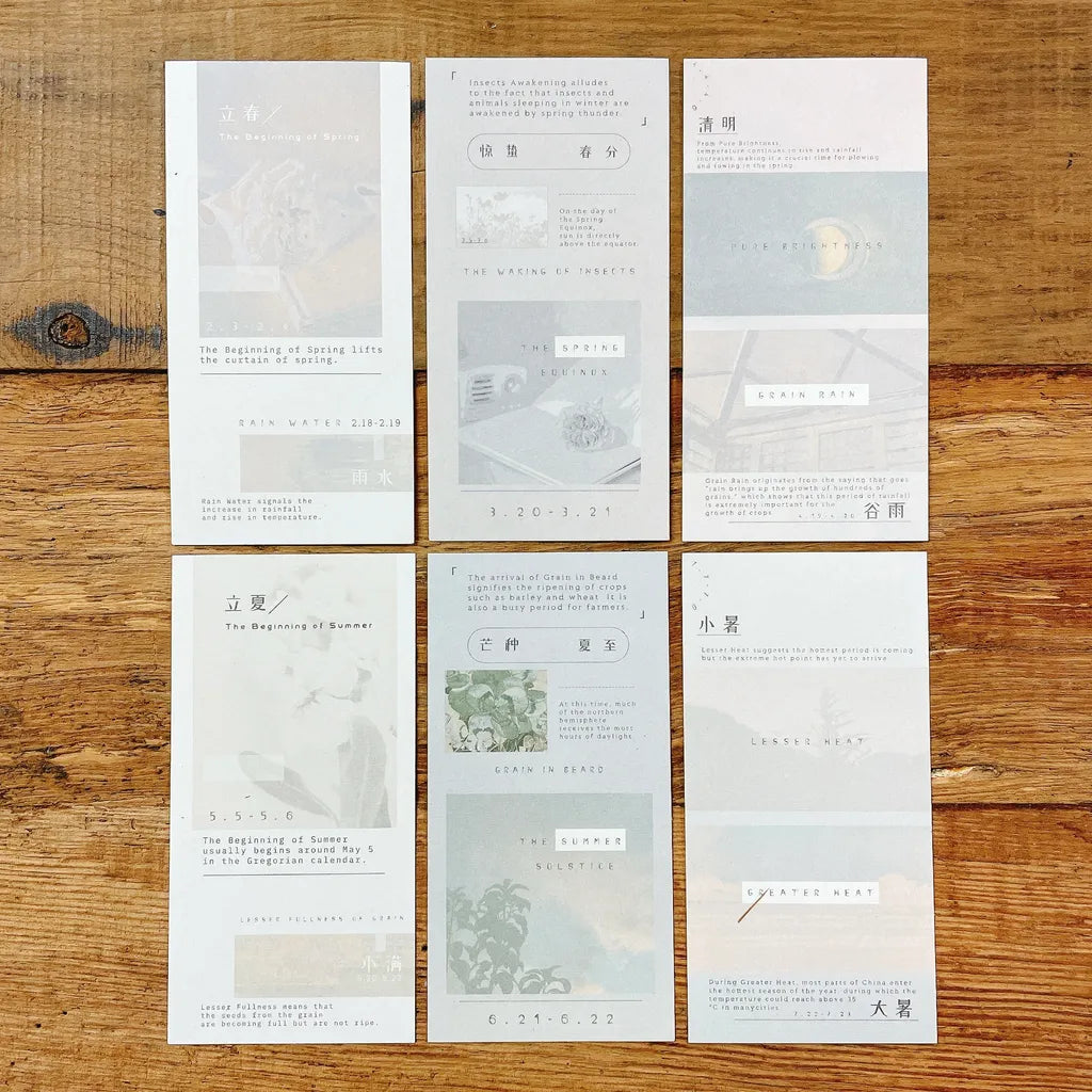Eight small Solar Terms Memo Pad Vol. 3 cards laid out in a grid on a wooden surface