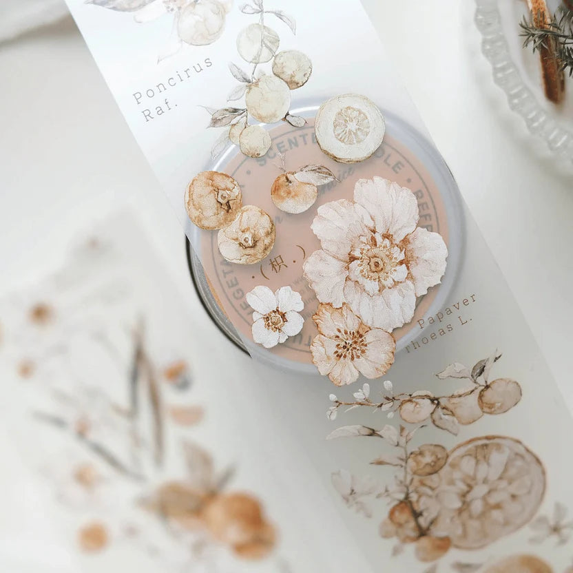 Cosmetic container with pressed flowers on a floral-patterned surface