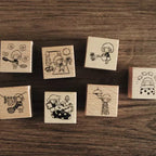 Set of wooden stamps with illustrations on a wooden surface