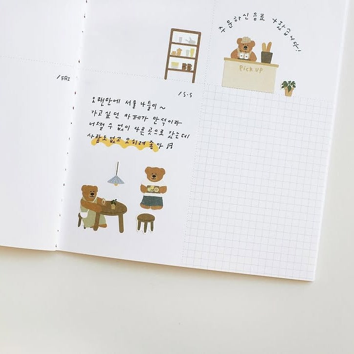 Notebook page with illustrated bears and text on a white background