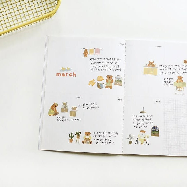 Open book with illustrations and text on a white background