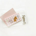 Notebook with a bear illustration and 'Happy time' text on a white background