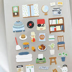 Collection of colorful felt stickers on a gray background