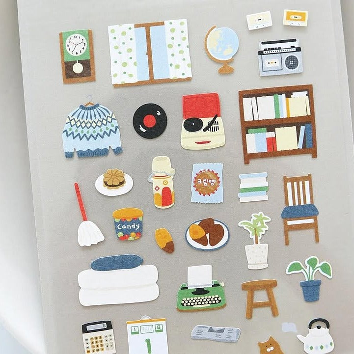 Colourful felt stickers on a grey background, from the Grandpa's Room Sticker Sheet